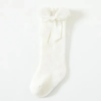 🎀 Medias Altas Infantiles con Moño Rojo – Antideslizantes, Algodón Suave.